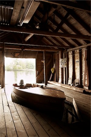 summer holiday frame - Wooden Boat in Boathouse, Ontario, Canada Stock Photo - Rights-Managed, Code: 700-02833545