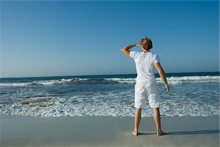 Man on the Beach Looking Into the Distance, Ibiza, Spain Foto de stock - Con derechos protegidos, Código: 700-02887037