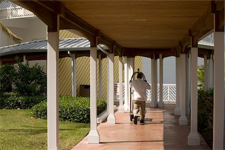 Bellhop Pushing Cart at Hotel, Grand Bahama Island, Bahamas Stock Photo - Rights-Managed, Code: 700-02887305