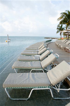 Lounge Chairs by Infinity Pool, Grand Bahama Island, Bahamas Stock Photo - Rights-Managed, Code: 700-02887312