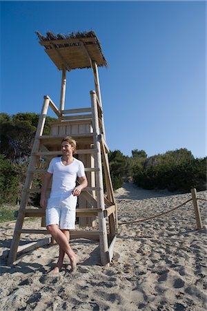 Man by Lifeguard Chair, Ibiza, Spain Stock Photo - Rights-Managed, Code: 700-02887484