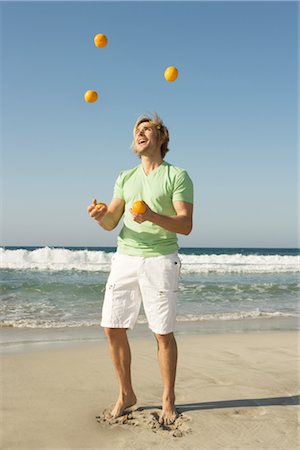 Man Juggling at Beach, Ibiza, Spain Fotografie stock - Rights-Managed, Codice: 700-02887480