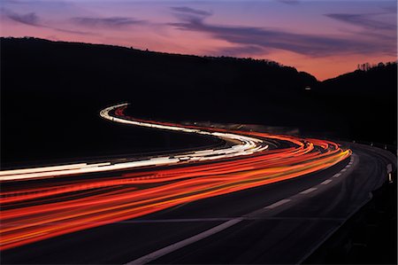 Streaking Lights on Winding Highway at Dusk, Spessart, Bavaria, Franconia, Germany Stock Photo - Rights-Managed, Code: 700-02883143