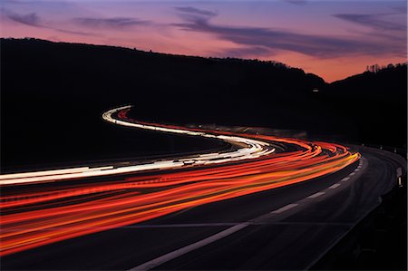 simsearch:632-08545840,k - Streaking Lights on Winding Highway at Dusk, Spessart, Bavaria, Franconia, Germany Stock Photo - Rights-Managed, Code: 700-02883143