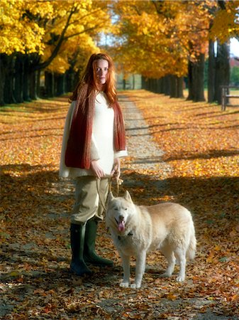 Portrait of Woman with Dog in Park in Autumn Foto de stock - Con derechos protegidos, Código: 700-02912387