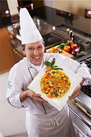 Chef Displaying Dish Stock Photo - Rights-Managed, Code: 700-02912449