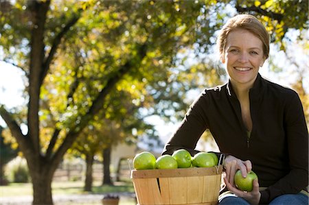 david schmidt - Woman Sitting With a Basket of Apples Stock Photo - Rights-Managed, Code: 700-02922689