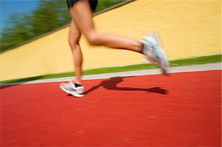 running with running shoes on a running track - Runner on Red Carpet Stock Photo - Rights-Managed, Code: 700-02922721