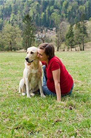 pregnant brunette with dog - Pregnant Woman Sitting in Field With Her Dog Stock Photo - Rights-Managed, Code: 700-02922757