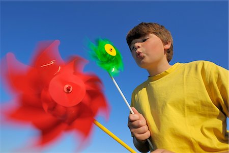 pictures of kids blowing a pinwheel - Boy Playing with Pinwheels Stock Photo - Rights-Managed, Code: 700-02935294