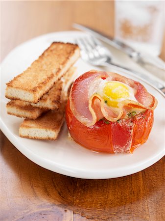 eggs and toast plate - Baked Tomato with Egg and Back Bacon and Toast Soldiers Stock Photo - Rights-Managed, Code: 700-02935591