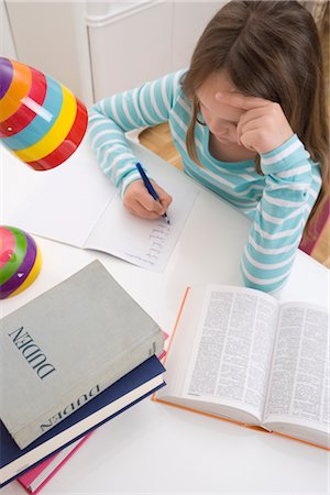 serious little girl - Girl Doing Homework Stock Photo - Rights-Managed, Code: 700-02935698