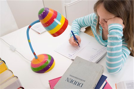 Girl Doing Homework Foto de stock - Con derechos protegidos, Código: 700-02935699