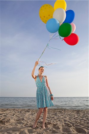 floating balloon woman caucasian - Woman on the Beach Holding a Bunch of Colourful Balloons Stock Photo - Rights-Managed, Code: 700-02943255
