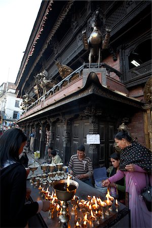 simsearch:649-08633038,k - People Lighting Candles at Temple, Kathmandu, Nepal Stock Photo - Rights-Managed, Code: 700-02957859