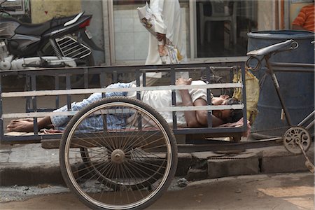 Man Resting in Cart, Kolkata, West Bengal, India Stock Photo - Rights-Managed, Code: 700-03004155
