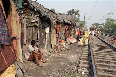 slum - People Living near Train Tracks, Tilijara, Kolkata, West Bengal, India Stock Photo - Rights-Managed, Code: 700-03004176