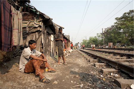 poverty asia - People Living near Train Tracks, Tilijara, Kolkata, West Bengal, India Stock Photo - Rights-Managed, Code: 700-03004177