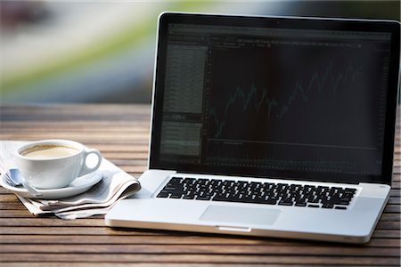 Laptop Computer, Newspaper and a Cup of Coffee Stock Photo - Rights-Managed, Code: 700-03014798