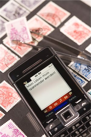 estampilla - Close-up of Text Message and Stamp Collection Foto de stock - Con derechos protegidos, Código: 700-03017003