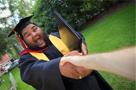 person with cap and gown - Graduate Shaking Hands Stock Photo - Rights-Managed, Code: 700-03017536