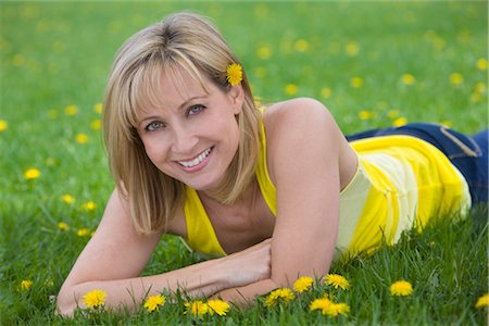 dandelion greens - Woman Lying in Meadow Stock Photo - Rights-Managed, Code: 700-03017731