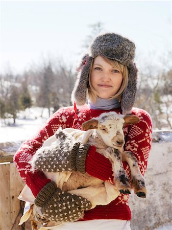 smiling farm worker - Woman Holding Newborn Lamb Stock Photo - Rights-Managed, Code: 700-03017743