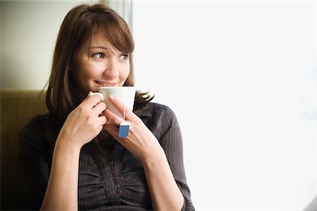 estonia - Woman Sipping a Cup of Tea Fotografie stock - Rights-Managed, Codice: 700-03054118