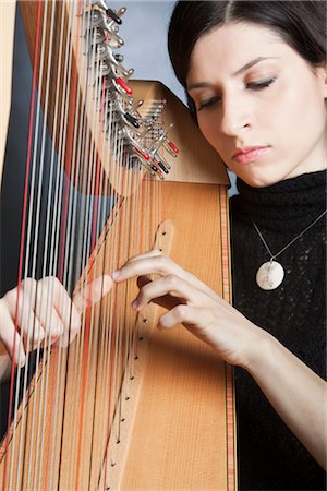 Woman Playing the Harp Foto de stock - Con derechos protegidos, Código: 700-03059200