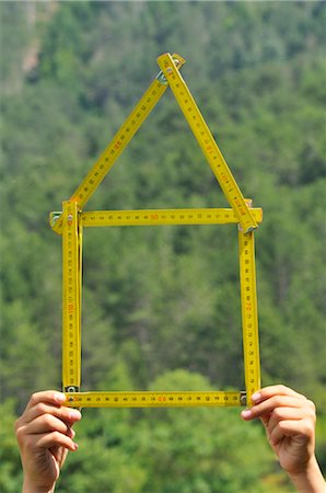 scale building - Person Holding Ruler in Shape of a House Stock Photo - Rights-Managed, Code: 700-03053994