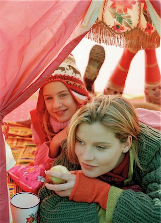 ficción - Mother and Daughter Cuddling in Tent Foto de stock - Con derechos protegidos, Código: 700-03067831