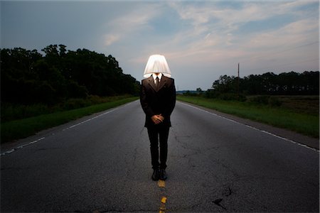 Businessman Wearing Lampshade Fotografie stock - Rights-Managed, Codice: 700-03075217