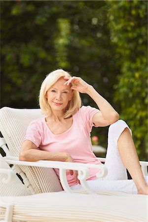 relaxing in lounge chair - Portrait of Woman Sitting in Lounge Chair Stock Photo - Rights-Managed, Code: 700-03075331