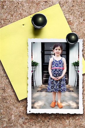 Photograph of Young Girl Pinned to Bulletin Board Fotografie stock - Rights-Managed, Codice: 700-03076003