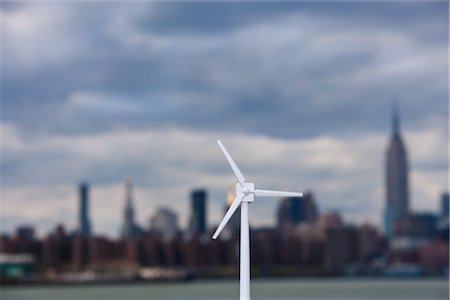 recurso natural - Model Wind Turbine With City in the Background Foto de stock - Con derechos protegidos, Código: 700-03152547
