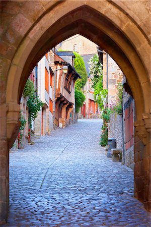 perspective buildings sunset - Archway Over Cobblestone Street at Dawn, Dinan, Ille-et-Vilaine, Brittany, France Stock Photo - Rights-Managed, Code: 700-03152908