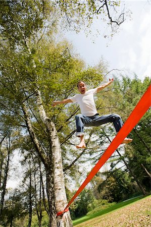 Man Slacklining Fotografie stock - Rights-Managed, Codice: 700-03161677