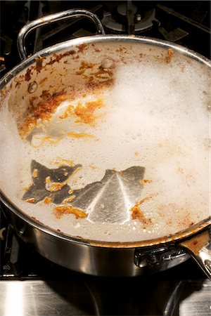 pan on stove - Dish Soap in Dirty Pan Stock Photo - Rights-Managed, Code: 700-03179005