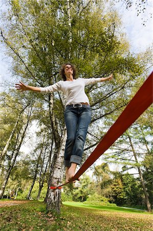 rope tree - Woman Slacklining Stock Photo - Rights-Managed, Code: 700-03179158