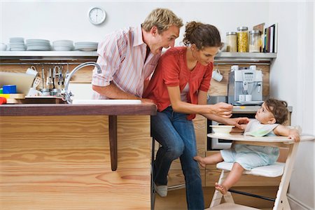 photo of mother feeding baby high chair - Parents Feeding Baby Stock Photo - Rights-Managed, Code: 700-03171581