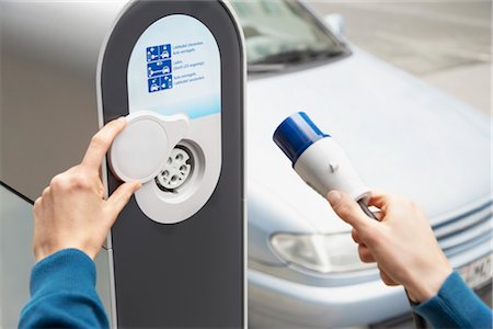 electric car charging - Plugging In Electric Car Stock Photo - Rights-Managed, Code: 700-03210375