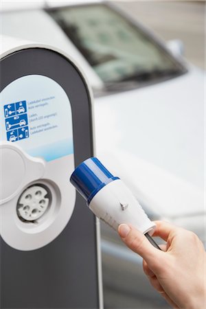 electric car charging - Plugging In Electric Car Stock Photo - Rights-Managed, Code: 700-03210376