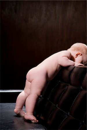 Baby Looking over Back of Sofa Stock Photo - Rights-Managed, Code: 700-03210573