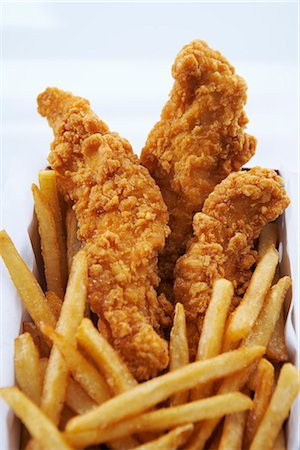 papas fritas - Chicken Fingers and Fries Foto de stock - Con derechos protegidos, Código: 700-03244084