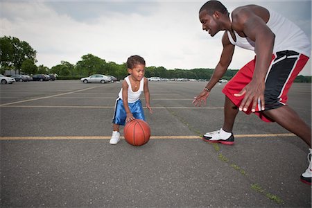 sports kids dad - Father and Son Playing Basketball Stock Photo - Rights-Managed, Code: 700-03244345