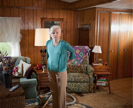 single old woman - Woman Standing in Her Living Room Foto de stock - Con derechos protegidos, Código: 700-03244357