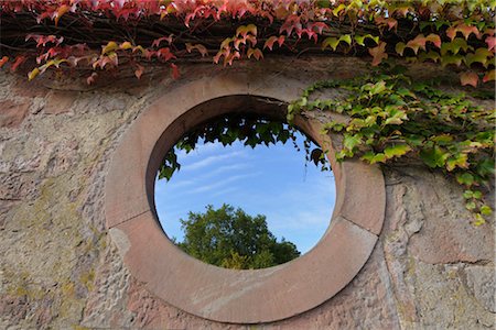 Circular Window in Garden Wall Stock Photo - Rights-Managed, Code: 700-03243984