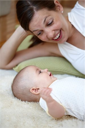 family lying on carpet - Mother Playing with Baby Stock Photo - Rights-Managed, Code: 700-03294890