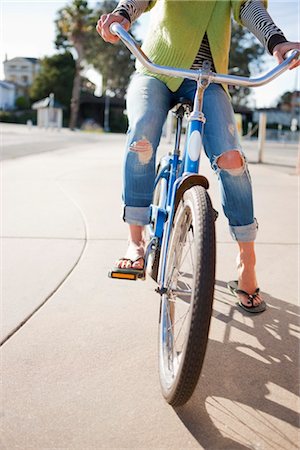 Woman Riding a Bicycle Along the Boardwalk, Santa Cruz, California, USA Stock Photo - Rights-Managed, Code: 700-03294991