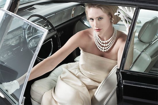 Portrait of Glamourous Woman in a 1964 Chevrolet Imperial LeBaron Stock Photo - Premium Rights-Managed, Artist: Michael Mahovlich, Image code: 700-03295279
